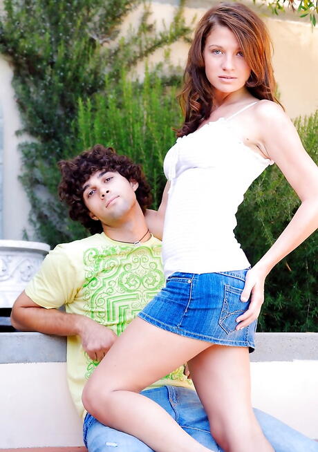 Foxy teen Gabby exposing her butt outdoor